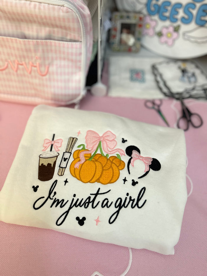 I’m Just a Girl Embroidered Pumpkin Park Sweatshirt