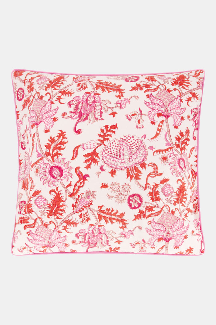 The Amanda Decorative Pillow by Roller Rabbit features a vibrant pink and red floral hand-blocked print on 100 cotton, white background, and is finished with pink piping along the edges.