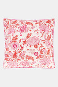 The Amanda Decorative Pillow by Roller Rabbit features a vibrant pink and red floral hand-blocked print on 100 cotton, white background, and is finished with pink piping along the edges.