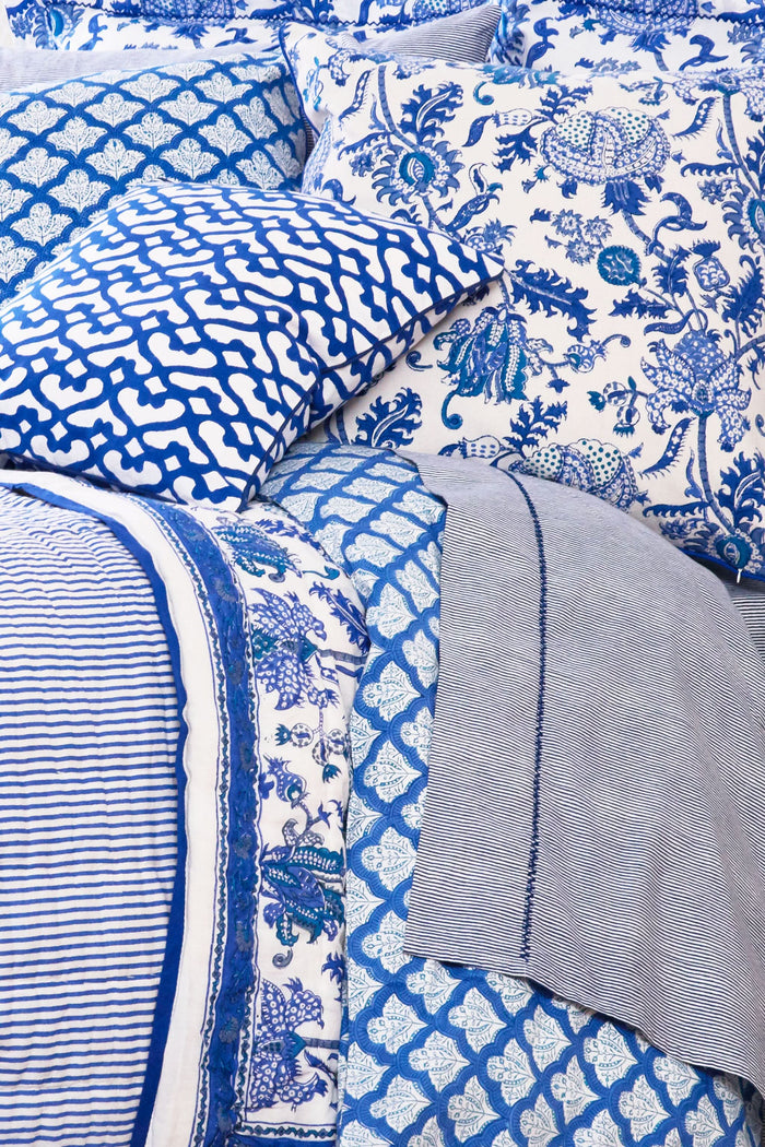 The Amanda Decorative Pillow by Roller Rabbit features a white 100 cotton cover with an intricate blue floral and leaf hand-blocked print, turquoise accents, and blue piping.