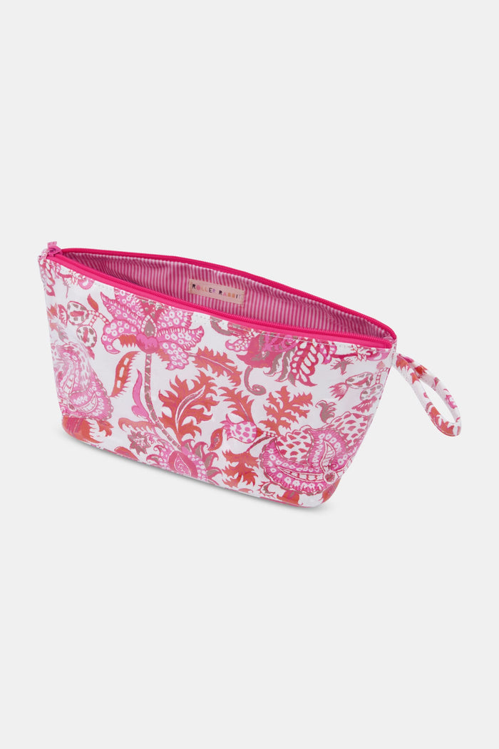 The Amanda Toiletry Case by Roller Rabbit is a rectangular bag with a zipper and small handle, featuring a pink and red floral and paisley print on white—ideal for organizing your travel essentials.