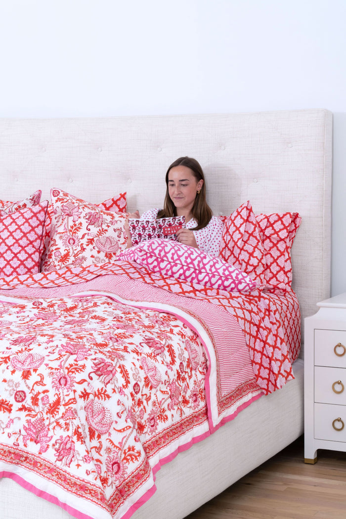 The Big Cata Decorative Pillow by Roller Rabbit features a white background with a bold pink geometric chain-link pattern. Made from 100 cotton with piped edges, it adds vibrant, modern style to any space.