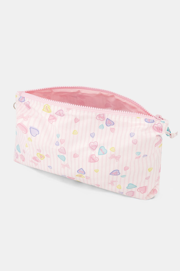 The Roller Rabbit Candy Heart Stripe Quilted Tote is a pastel pink weekend bag with scalloped edges, a matching bow on one handle, double handles, and a front zipper pocket.