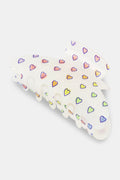 The Roller Rabbit Disco Hearts Claw Clip is a white hair accessory featuring a pattern of small multicolored hearts, displayed on a plain light background.