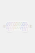 The Roller Rabbit Disco Hearts Eye Mask is a white Pima cotton mask with rows of small, colorful hearts and a matching strap—an ideal loungewear gift, shown against a plain white background.