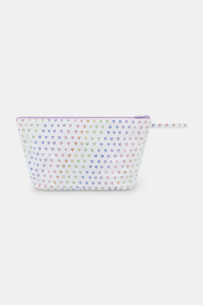 The Roller Rabbit Disco Hearts Toiletry Case is a white, rectangular zippered pouch with a strap, featuring a colorful heart pattern. Water-resistant and great for organizing your travel essentials.