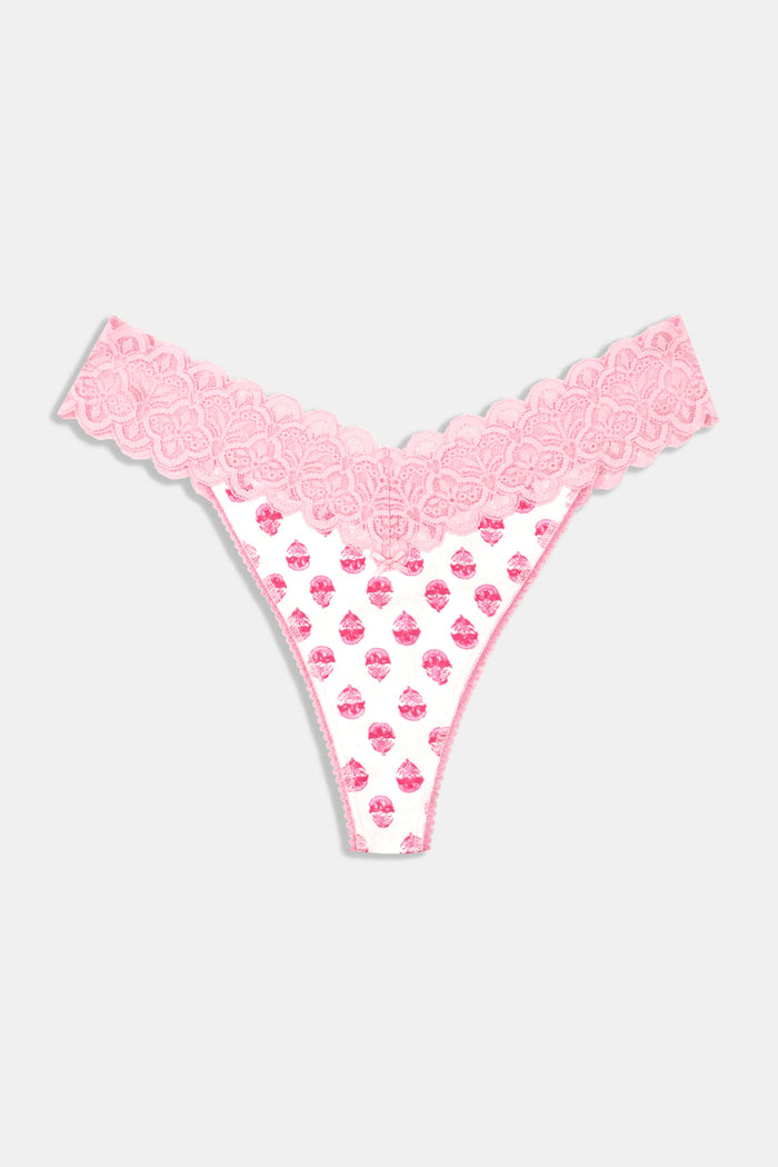A person models the Roller Rabbit Ditsy Daisy Pointelle Jay Thong and a white tank top with pink cupcake patterns, standing against a plain white background. Only their torso and upper legs are visible.