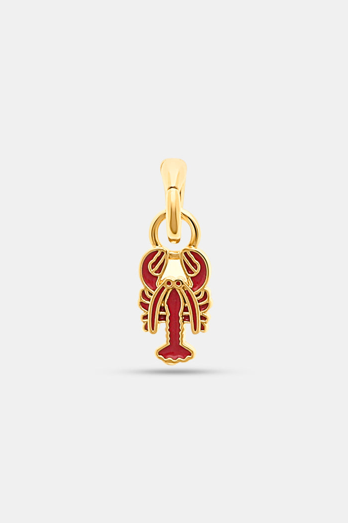The Roller Rabbit Enamel Lobster Charm, a gold pendant with red enamel details, is shown against a plain light gray background.