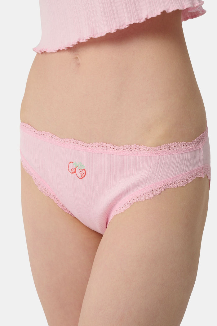 The Roller Rabbit Fruits Embroidery Bikini 4 Pack features four ribbed girls' panties—two pink, two light blue—made from soft Pima cotton with delicate lace trim and playful embroidered fruits for a retro touch.