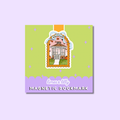 A square decorative magnetic bookmark with a pastel design. The top portion is light lime green with small lavender star accents, and the bottom is lavender with the text 'limes & lily MAGNETIC BOOKMARK' in white.