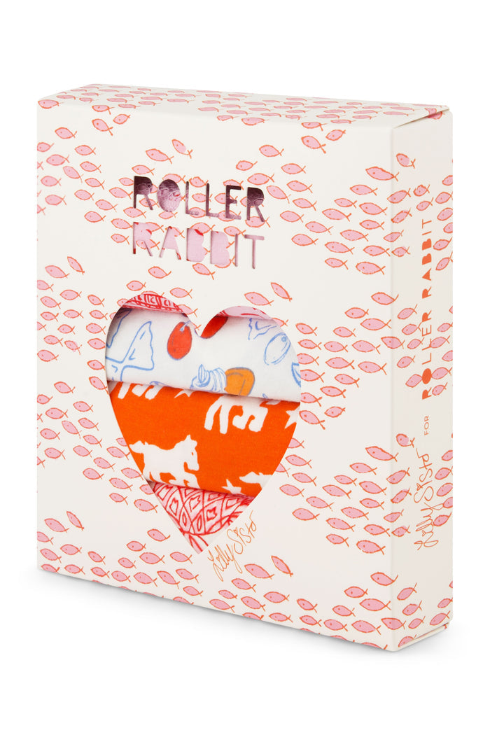 The Roller Rabbit Globe Trotter Thong 4 Pack features four women's lace trim thongs in blue, red, pink, and light pink, each with playful patterns and prints, displayed in two rows on a light background.