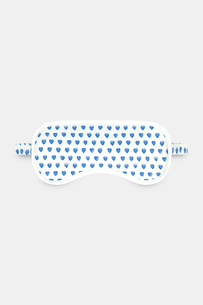 The Roller Rabbit Hearts Eye Mask, crafted from soft Pima Cotton with blue heart prints and an elastic strap, makes a cozy loungewear gift.