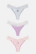 The Roller Rabbit Hearts Lace Thong 3 Pack features three thongs displayed vertically: blue hearts on top, solid lavender in the middle, and red hearts on the bottom, each with a center bow for a comfy and cute look.