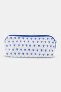 The Roller Rabbit Hearts Makeup Bag is a white water-resistant canvas pouch with a blue zipper and an all-over blue heart print.