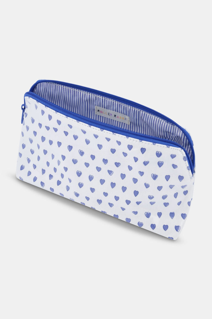 The Roller Rabbit Hearts Makeup Bag is a white water-resistant canvas pouch with a blue zipper and an all-over blue heart print.