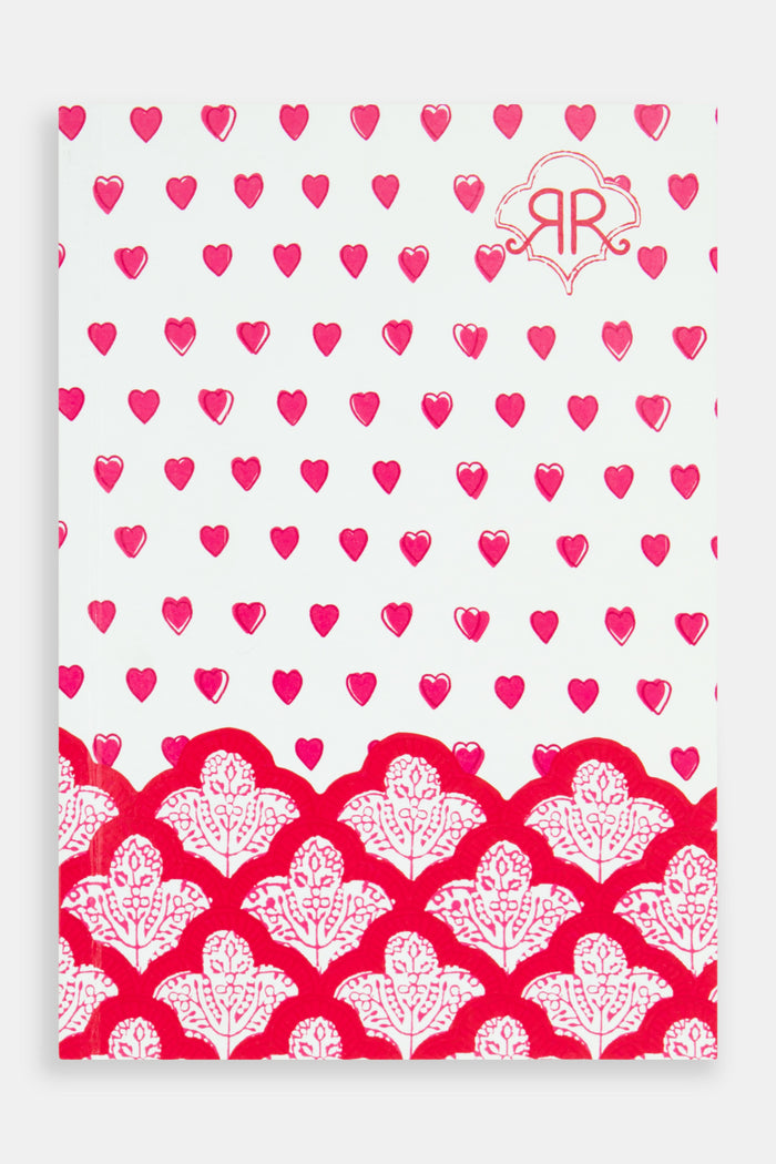 The Hearts Notebook by Roller Rabbit features a white cover with small red and pink hearts, a scalloped red and white floral border at the bottom, and a “RR” logo—perfect for pairing with your favorite lined notebook.