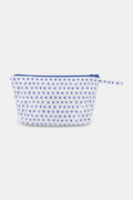 The Roller Rabbit Hearts Toiletry Case is a water-resistant white pouch featuring blue heart prints and a matching blue zipper pull, ideal for travel essentials, shown against a light gray background.