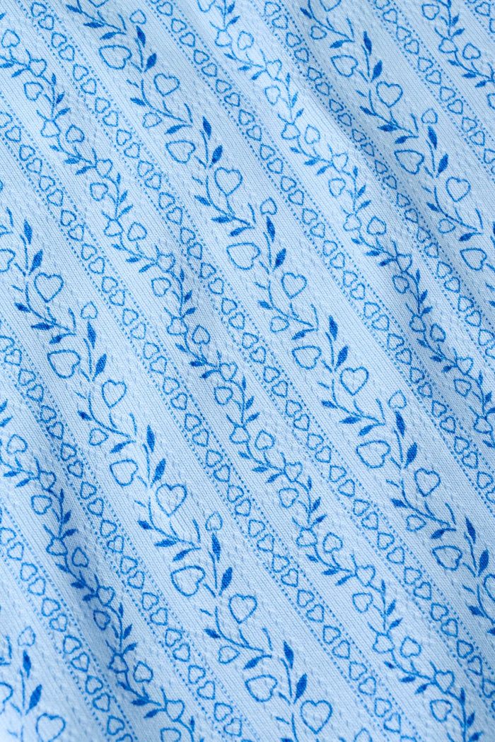 A person models the Roller Rabbit Hearts Vine Monroe Pant—loose-fitting, light blue pajama bottoms with a subtle vertical pattern. The image highlights only the lower body and the comfort of the cotton pointelle fabric.
