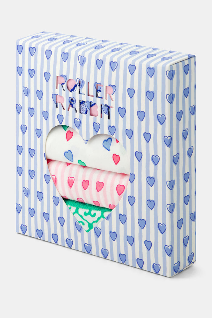The Roller Rabbit Icons Thong 4 Pack includes lace-trimmed women’s cotton thongs in green, light blue with hearts, pale pink with hearts, and pale pink with a blue butterfly design.