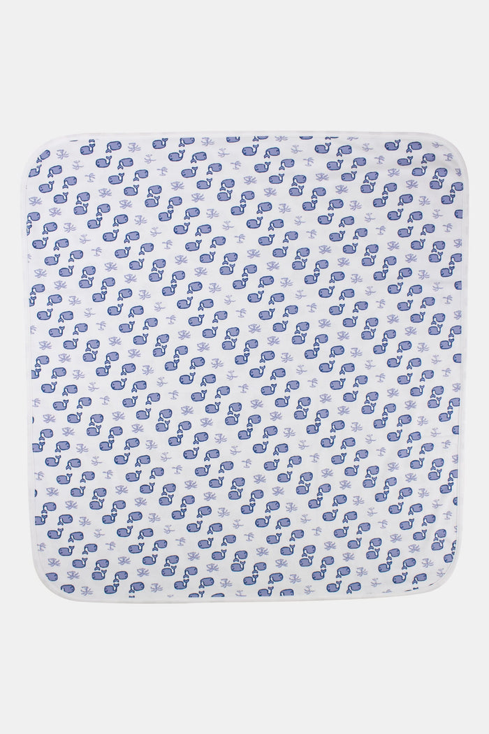 The Roller Rabbit Infant Moby Receiving Blanket is a white Pima cotton baby blanket with blue whale and coral patterns, shown neatly folded to display both sides.