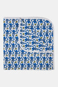 The Roller Rabbit Infant Monkey Receiving Blanket is a white Pima cotton baby blanket with a blue monkey and yellow banana pattern, rounded corners, and a folded edge.