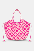 The Jemina Bondi Bag by Roller Rabbit is a large pink and white cotton canvas tote featuring a scalloped pattern, striped handles, and side drawstrings, shown against a plain white background.