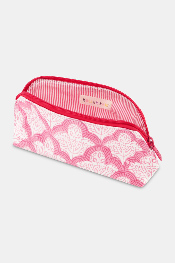 The Jemina Makeup Bag by Roller Rabbit is a pink and white zippered cosmetic organizer with a repeating floral pattern, a curved top, and a red zipper, shown against a plain white background.