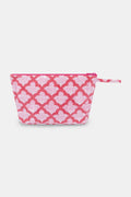 The Jemina Toiletry Case by Roller Rabbit features a pink zippered design with a white floral pattern and matching pink strap, shown against a plain white background. Perfect for organizing your travel essentials.