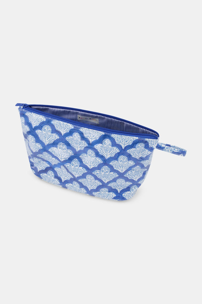 The Jemina Toiletry Case by Roller Rabbit is a blue and white floral zippered pouch with a side handle, perfect for travel essentials or as a water-resistant toiletry case. Shown on a plain light background.