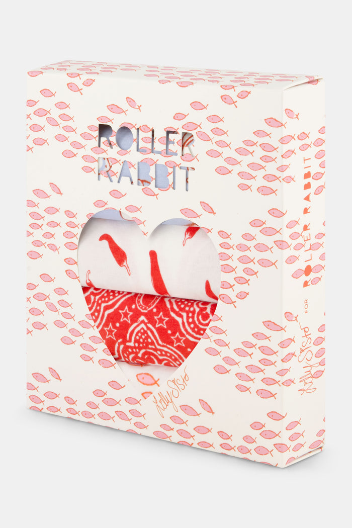 The Jet Set Bikini 4 Pack by Roller Rabbit includes four cotton-modal pairs with lace trim: blue with cherries, light pink with hearts, white with red chili peppers, and red with a geometric design.