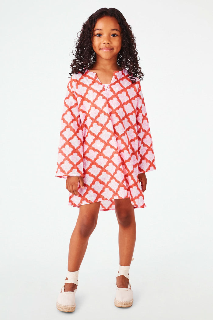A young girl with curly hair smiles, wearing the Roller Rabbit Kids Jemina Kurta and beige espadrille sandals, standing against a plain white background.