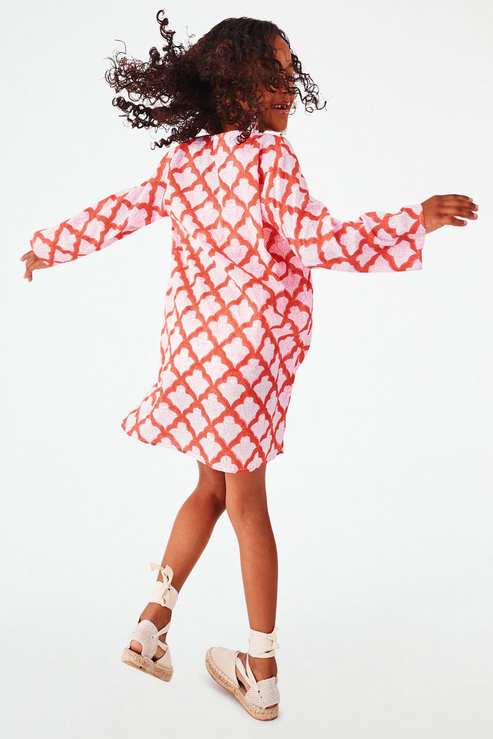 A young girl with curly hair smiles, wearing the Roller Rabbit Kids Jemina Kurta and beige espadrille sandals, standing against a plain white background.