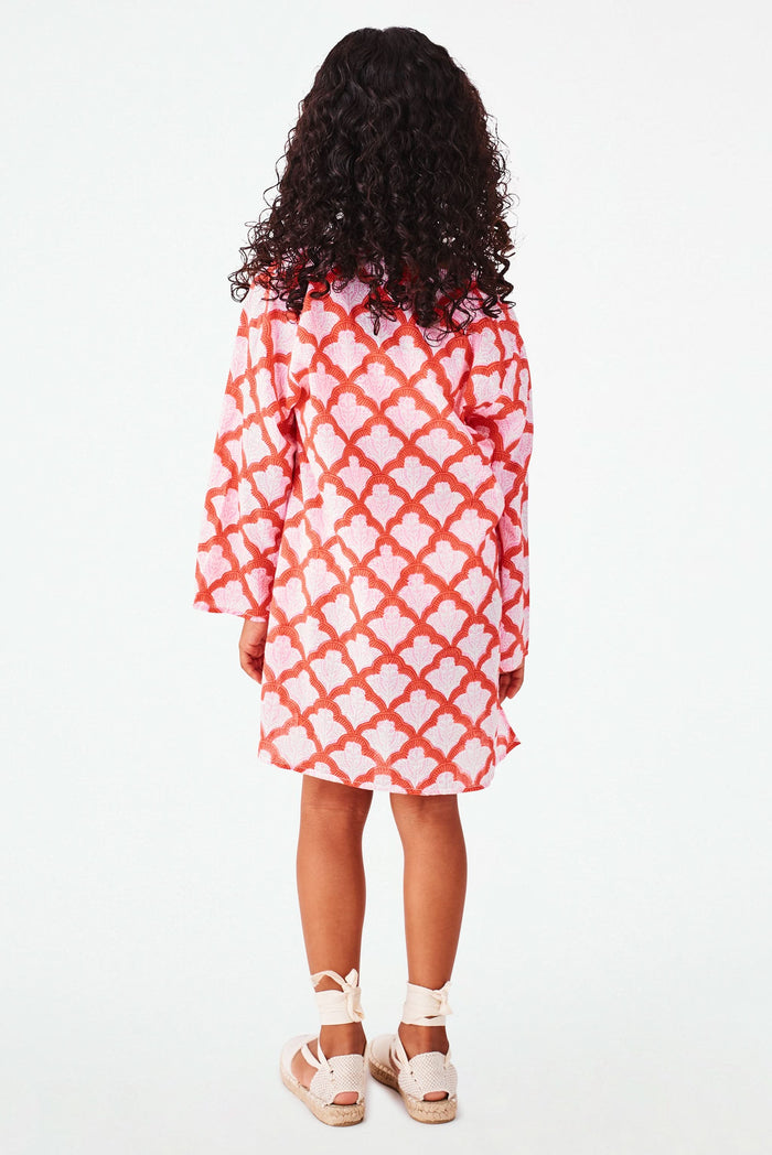 A young girl with curly hair smiles, wearing the Roller Rabbit Kids Jemina Kurta and beige espadrille sandals, standing against a plain white background.