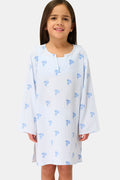 A young girl with long brown hair smiles while wearing a Roller Rabbit Kids Mini Monkey Kurta, made of cotton seersucker with a light blue and white striped pattern, blue floral accents, and long sleeves, against a plain white background.