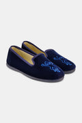 A pair of Kids Monkey Verona Slippers by Roller Rabbit, featuring embroidered monkeys, light tan lining, and black soles, is displayed on a plain white background.