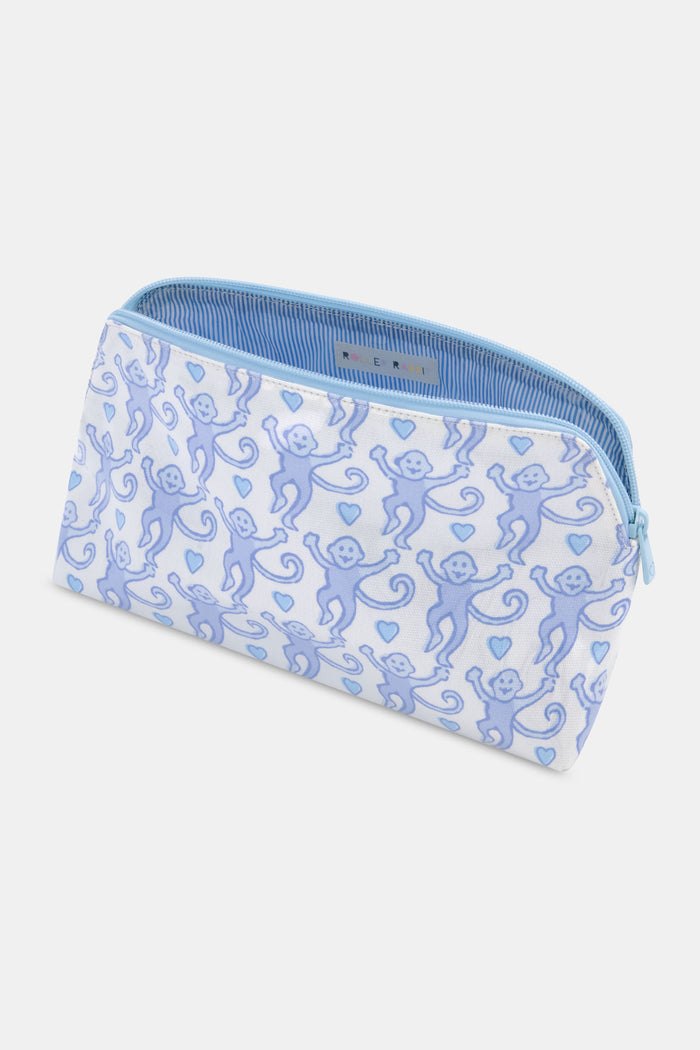 The Lovely Monkey Makeup Bag by Roller Rabbit is a white cotton canvas bag with a zippered top, decorated with light blue smiling cartoon monkeys and hearts—ideal as a cute travel or makeup bag.
