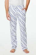A person stands barefoot against a plain background, one hand in their pocket, wearing Roller Rabbit's Mens Moby Simon Pant—crafted from soft Pima cotton and featuring a blue paisley pattern.