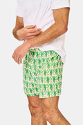 A man wearing Roller Rabbit’s Mens Monkey Boxer Set—a white T-shirt and cotton boxers—stands against a plain white background.