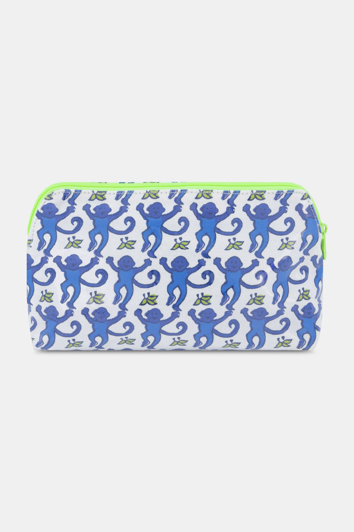 The Roller Rabbit Monkey Makeup Bag is a rectangular cotton canvas pouch featuring blue monkeys holding hands on a white background, finished with a neon green zipper.