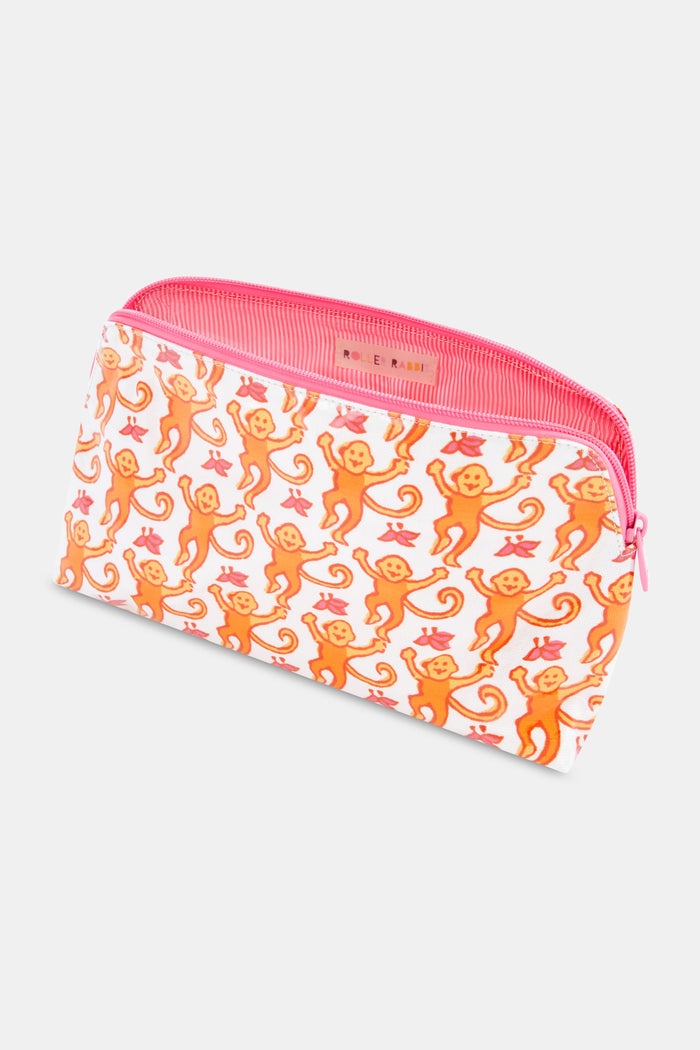 The Roller Rabbit Monkey Makeup Bag features a white cotton canvas with a pink zipper, adorned with orange monkeys and red leaves. Perfect for travel or daily makeup essentials.