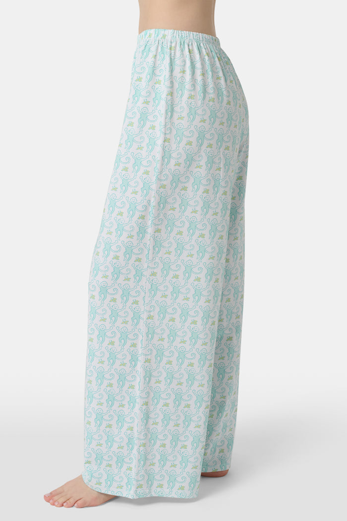 Wearing Roller Rabbit’s Monkey Monroe Pant in light blue and white heart-print cotton modal, the barefoot person stands against a white background, with only their lower torso and legs visible.