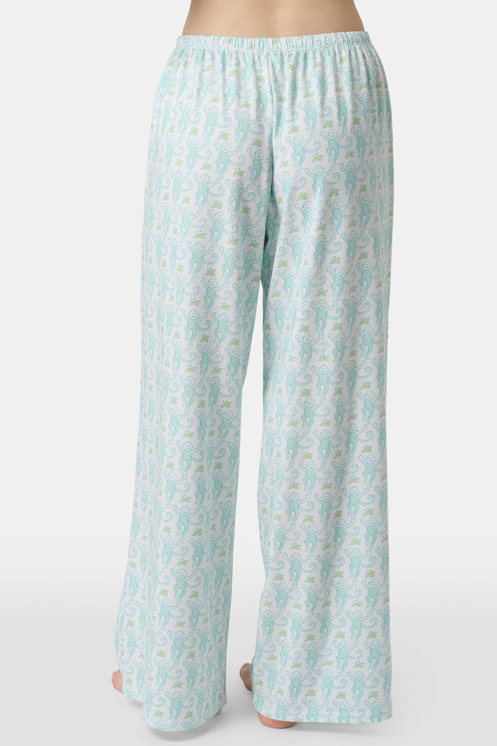 Wearing Roller Rabbit’s Monkey Monroe Pant in light blue and white heart-print cotton modal, the barefoot person stands against a white background, with only their lower torso and legs visible.