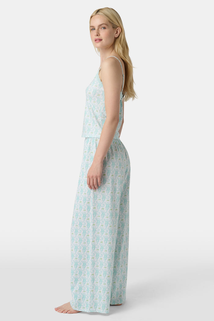 Wearing Roller Rabbit’s Monkey Monroe Pant in light blue and white heart-print cotton modal, the barefoot person stands against a white background, with only their lower torso and legs visible.