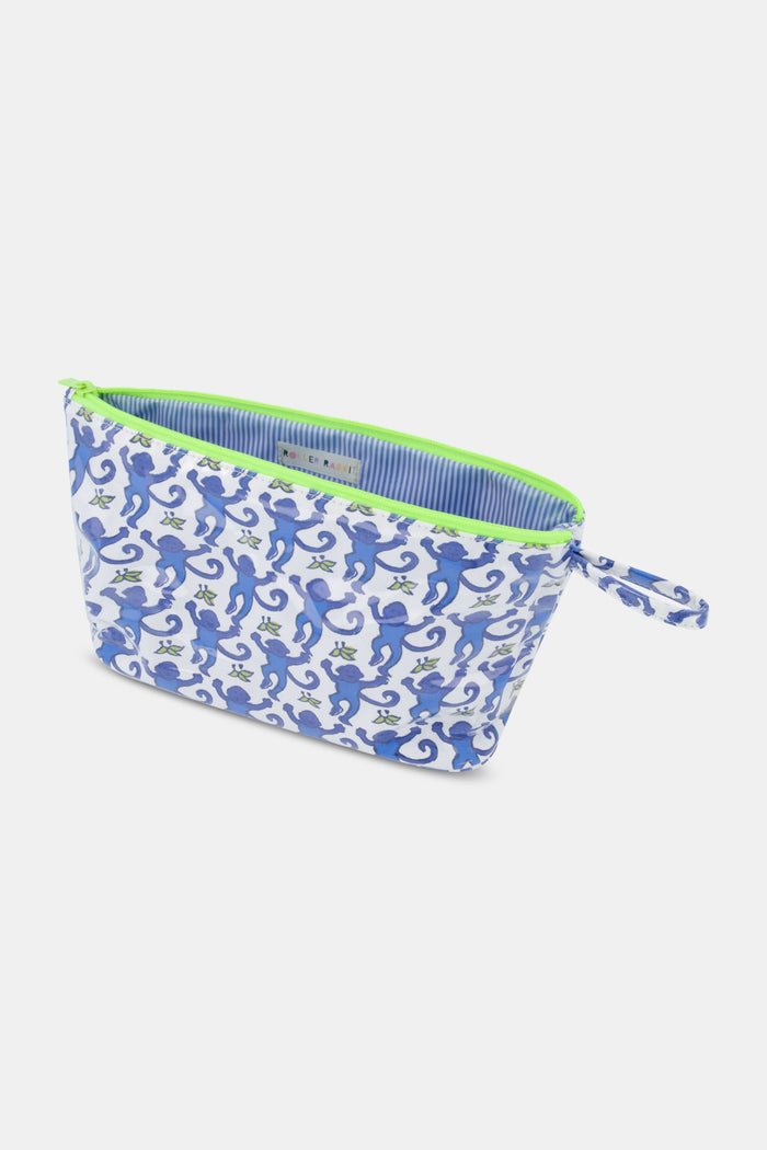 The Roller Rabbit Monkey Toiletry Case is water-resistant, with a blue and green monkey print on white, plus a green zipper and side handle—ideal for carrying travel essentials.