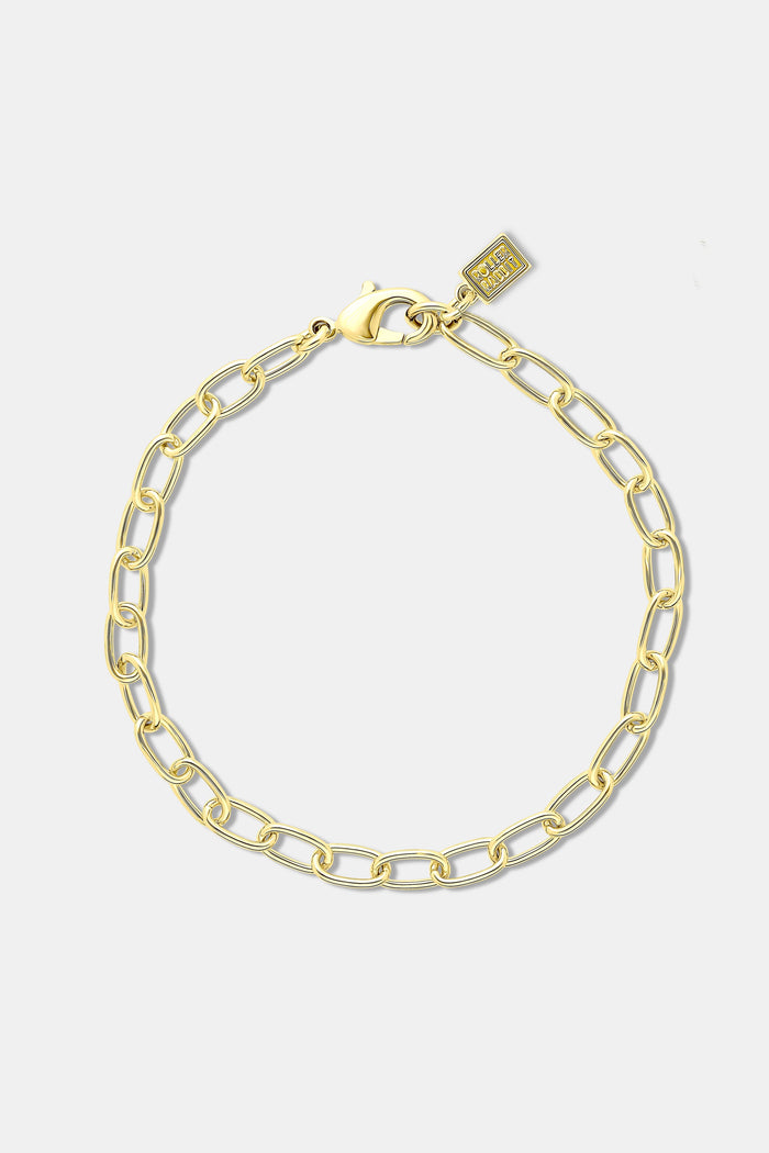 The Roller Rabbit Paperclip Bracelet Chain is an elegant imitation gold bracelet with oval links, a lobster clasp, and a small rectangular tag, shown on a plain white background.