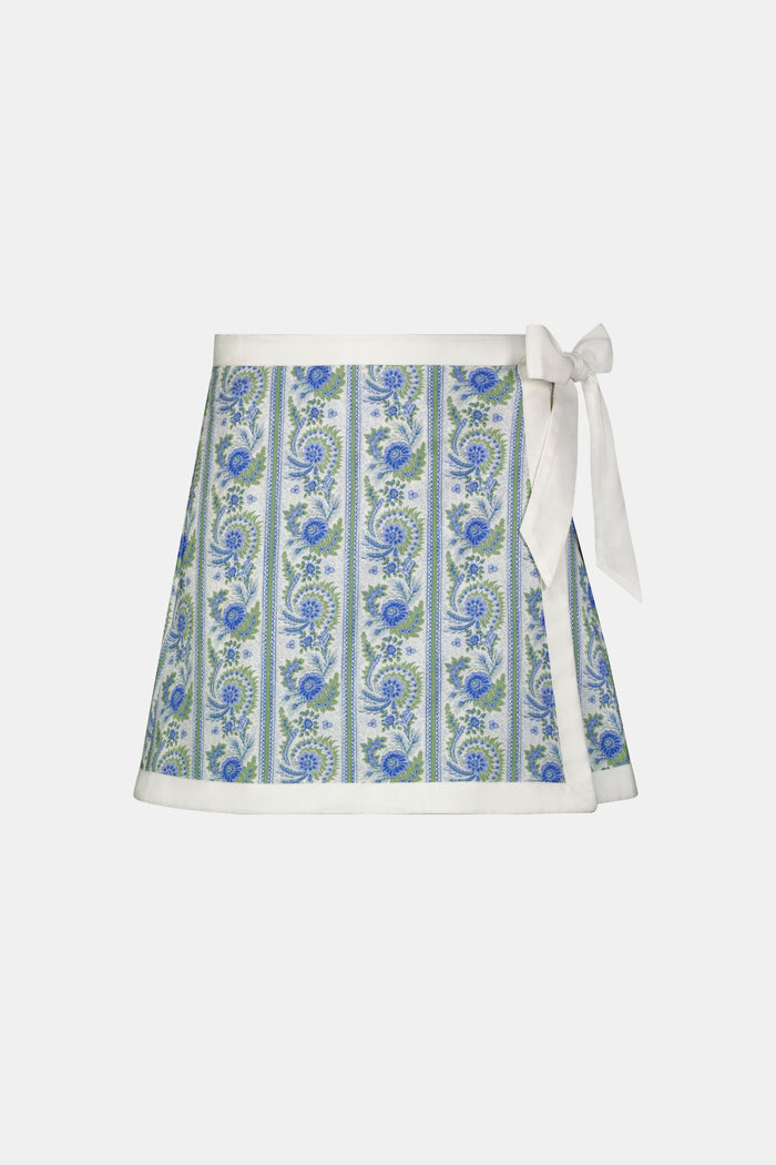 A person wears the Roller Rabbit Provencal Stripe Marisol Wrap Pareo, tying it around their waist. Only their torso and upper legs are visible.