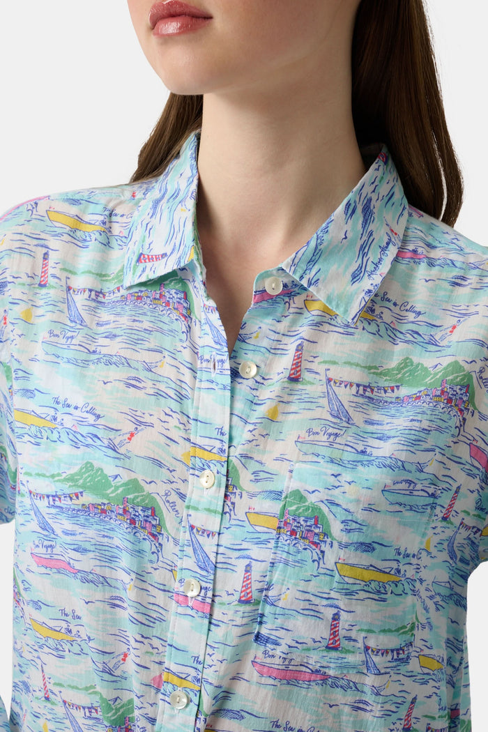 A woman wears the Roller Rabbit Regatta Boyfriend Dress, a loose-fitting cotton voile piece with long sleeves and colorful pastel abstract patterns. The thigh-length dress features a relaxed fit as she stands against a plain, light background.