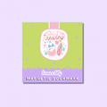 A square product card for a magnetic bookmark featuring a whimsical illustration. The card has a light green center with a pink and lavender scalloped bottom border, and a central illustration of a book character with the words 'SALTY reader'.
