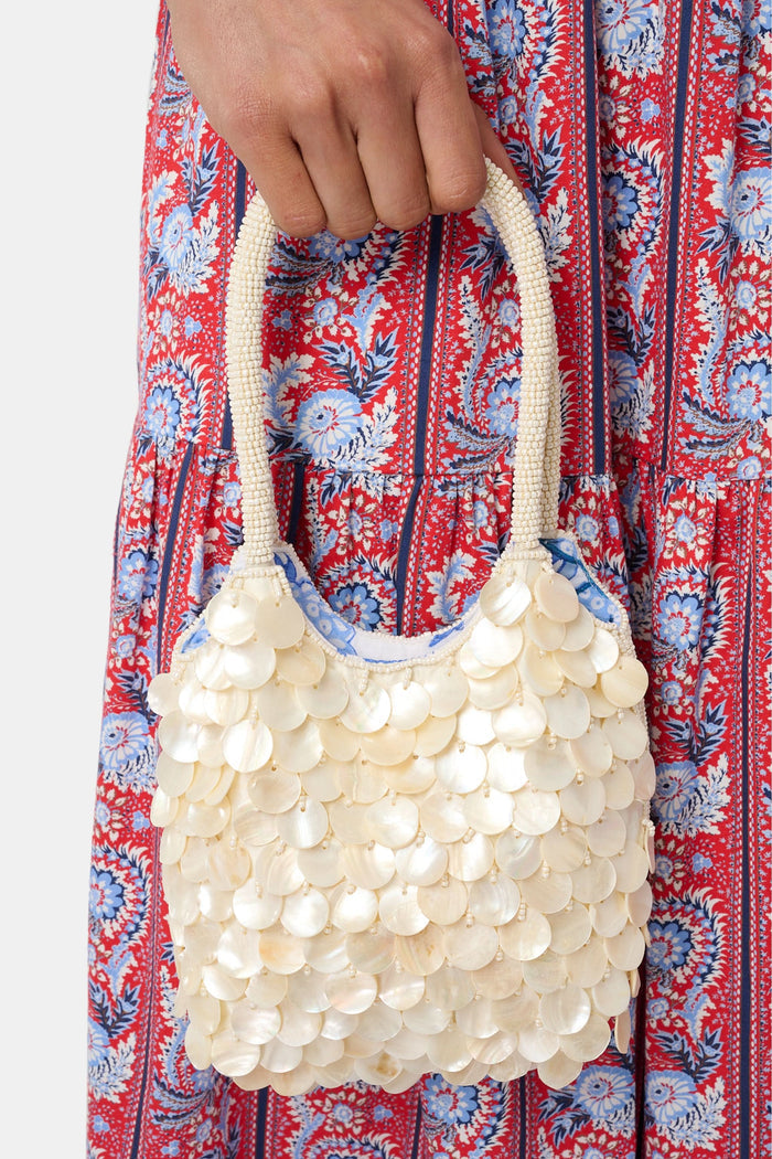 Handbag made of pearls on a white background
