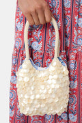 Handbag made of pearls on a white background